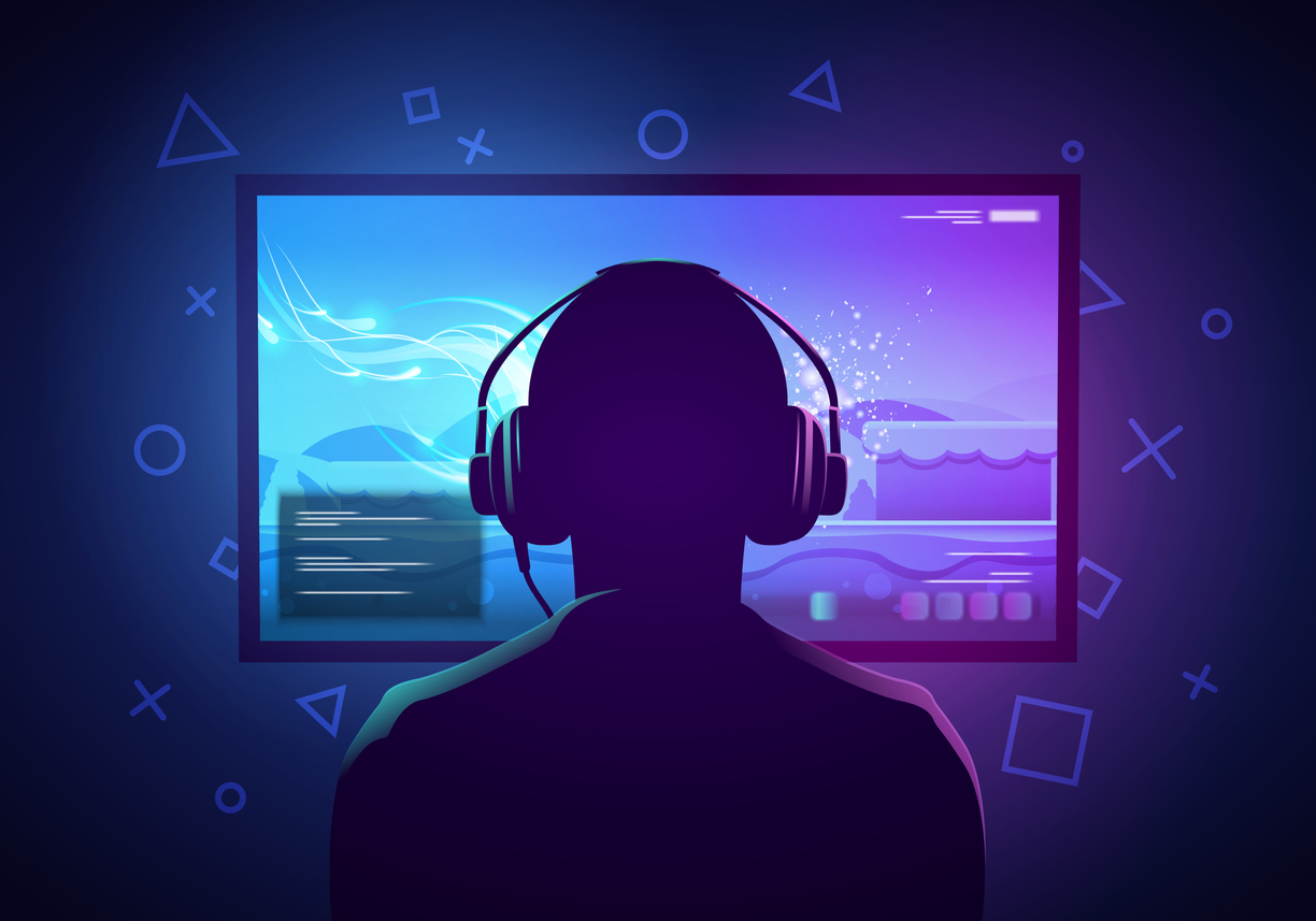 Gutt med headsett foran gamingskjerm